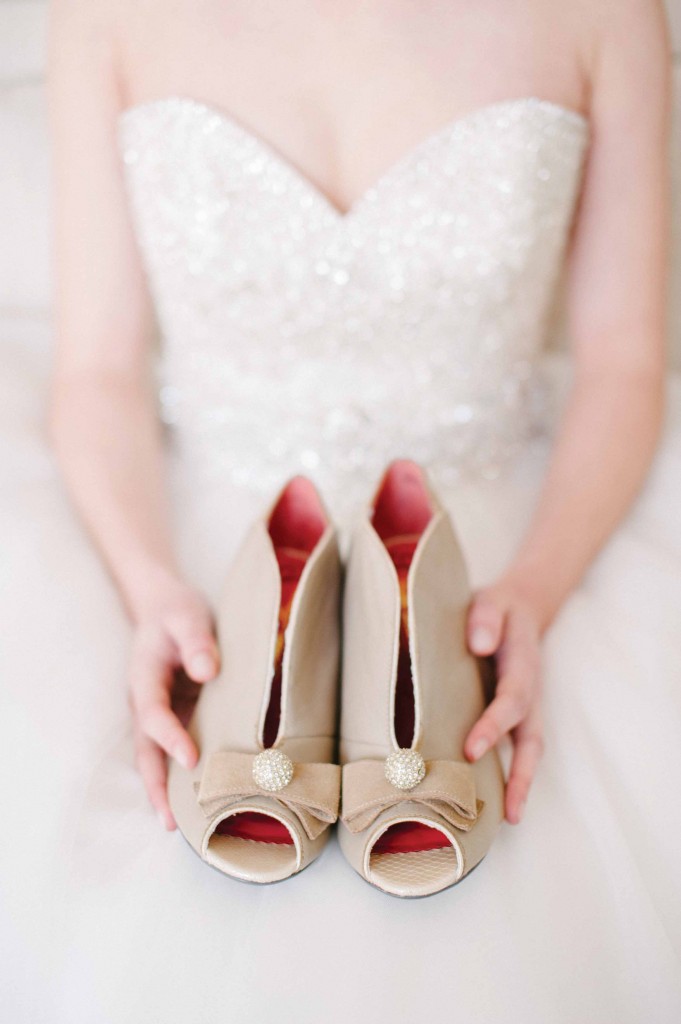 Bride holding her shoes
